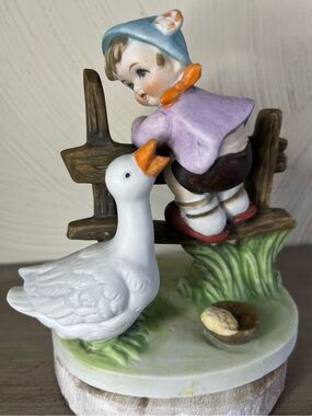 Porcelain Boy and Goose Figurine in White, Lavender, Blue